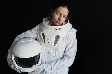 Wall Mural - Female astronaut on a black background. Fantastic space suit. Exploration of outer space.