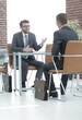 © ASDF - business partners behind a Desk