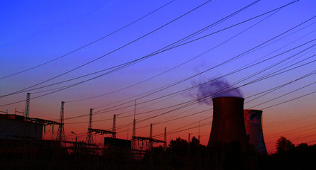 Two huge pipes on the power plant from which the smoke goes