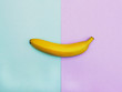 Flat lay fruit Top view trendy photo Ripe yellow banana is lying on two-tone background Colorful flat lay photo of banana fruit with space for text