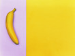 Flat lay fruit Top view trendy photo Ripe yellow banana is lying on two-tone background Colorful flat lay photo of banana fruit with space for text