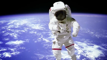 Wall Mural - Astronaut spaceman outer space people planet earth. Elements of this footage furnished by NASA.