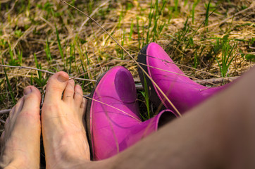 Male and female feet on the grass