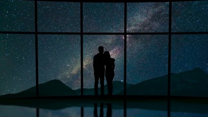 Wall Mural - The couple stand near a window against the meteor shower in the sky. time lapse