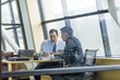 © Mike Kemp/Blend Images - Businessmen talking in meeting