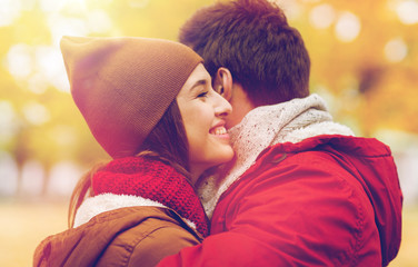 Poster - happy young couple hugging in autumn park