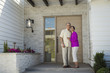 © Erik Isakson/Blend Images - Older couple posing on front stoop of house