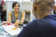© Adam Hester/Blend Images - Smiling people talking in meeting