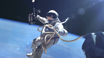 Wall Mural - Astronaut in outer space against the Earth background. Elements of this image furnished by NASA.