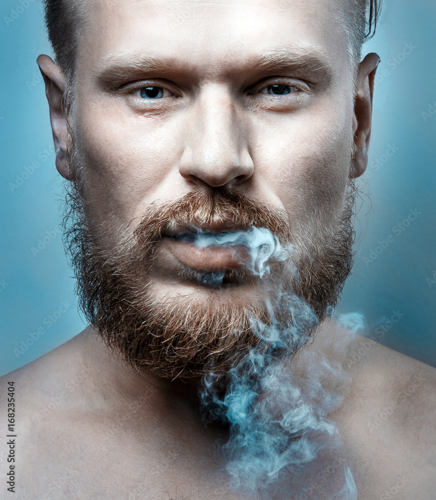 cigarette hanging out of mouth Close-up a senior man holding in his Stock Photo cigarette hanging out of mouth