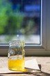 © allenkayaa - Organic pure honey in jar on window sill. Stream of honey