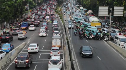 Wall Mural - JAKARTA, Indonesia. August 14, 2017: Video footage of traffic jam on Casablanca highway in Jakarta with crowded cars and motorcycle