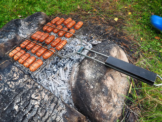 Fried sausages at the stake