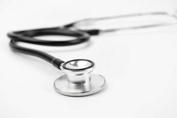 Close up view of black stethoscope on white isolate background