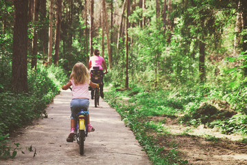 Wall Mural - family riding bikes in summer nature