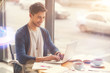 © zinkevych - Positive freelance student sitting in the cafe