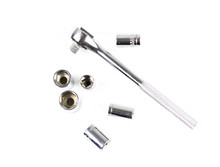 Silver Colored Torque Wrenchon White Background With Assorted Sockets