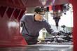 © Blue Jean Images - Young engineer working in the factory