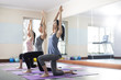 © Blue Jean Images - Young women exercising at gym