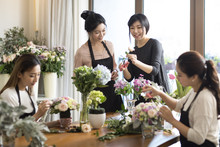 Young Women Learning Flower Arrangement