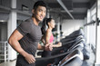 © Blue Jean Images - Couple exercising on treadmills in gym