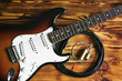 Electric guitar and guitar accessories on wooden table. Close up. Making music concept.