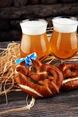 Wall Mural - Original bavarian pretzels with beer on wooden board. Oktoberfes