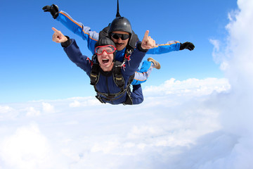 Wall Mural - Skydiving. Tandem jump. Happy Passenger.