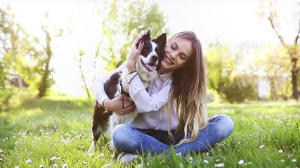 Wall Mural - Beautiful woman walking cute dog in nature