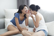 © Blue Jean Images - Best female friends whispering