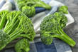 Fresh green broccoli and napkin on table