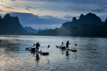 Wall Mural - Fisherman of Guilin, Li River and Karst mountains during the blue hour of dawn,Guangxi  China