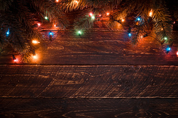 Wall Mural - christmas tree and colorful lights bulb. merry christmas (xmas) background. old wood texture - vinta