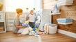 Happy family mother   housewife and children in   laundry load washing machine
