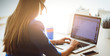 © s_l - Portrait of beautiful business woman working at her desk with headset and laptop