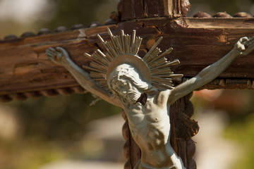 Wall Mural - crucifixion of Jesus Christ as a symbol of resurrection and immortality of the human soul (old wooden statue)