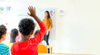 © weedezign - African American ethnicity kid hand up for answer question of teacher in classroom,Kindergarten preschool education concept,Mock up banner space for adding your text