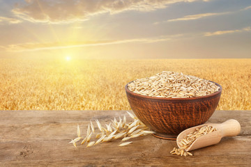 Wall Mural - oat grains in bowl on table