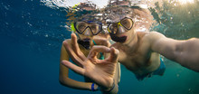 Young Couple Enjoying Snorkeling Underwater. Selfie Portrait