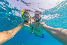 Young Couple Enjoying Snorkeling Underwater. Selfie Portrait