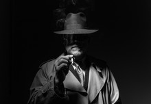 Man Smoking In The Dark