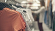 Girl choosing t-shirt clothes, blurred backgound. selective focus