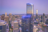 Fototapeta  - Aerial view of dramatic sunset at Melbourne city skyline