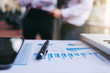 © Freedomz - Teamwork process, Close up of pen, Blurred abstract background of Business people meeting