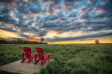 Red Chairs Before Beautiful Sunrise in Elk Island Park