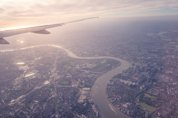   Aerial view of Central London through airplane window vintage colour