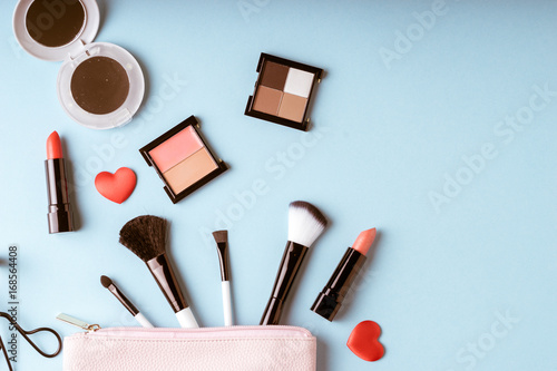 Fotografering Set of Makeup cosmetics products with bag on top view, vintage style