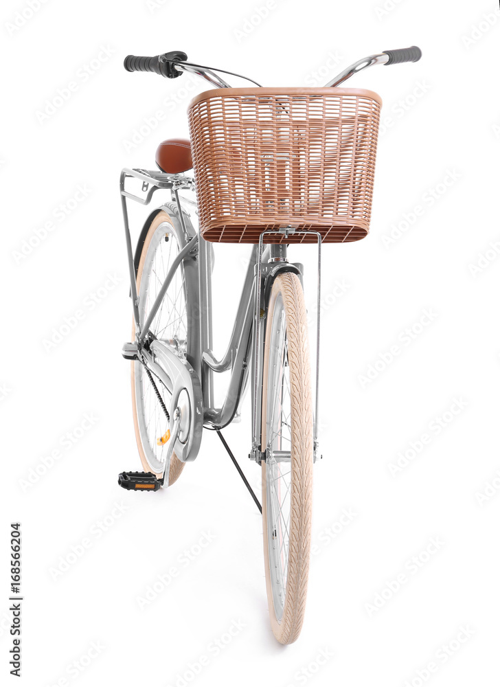 Bicycle with wicker basket on white background