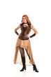 © faestock - full length portrait of a red haired lady, wearing a steampunk inspired outfit, isolated  on white background.
