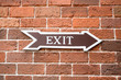 exit sign on brick wall